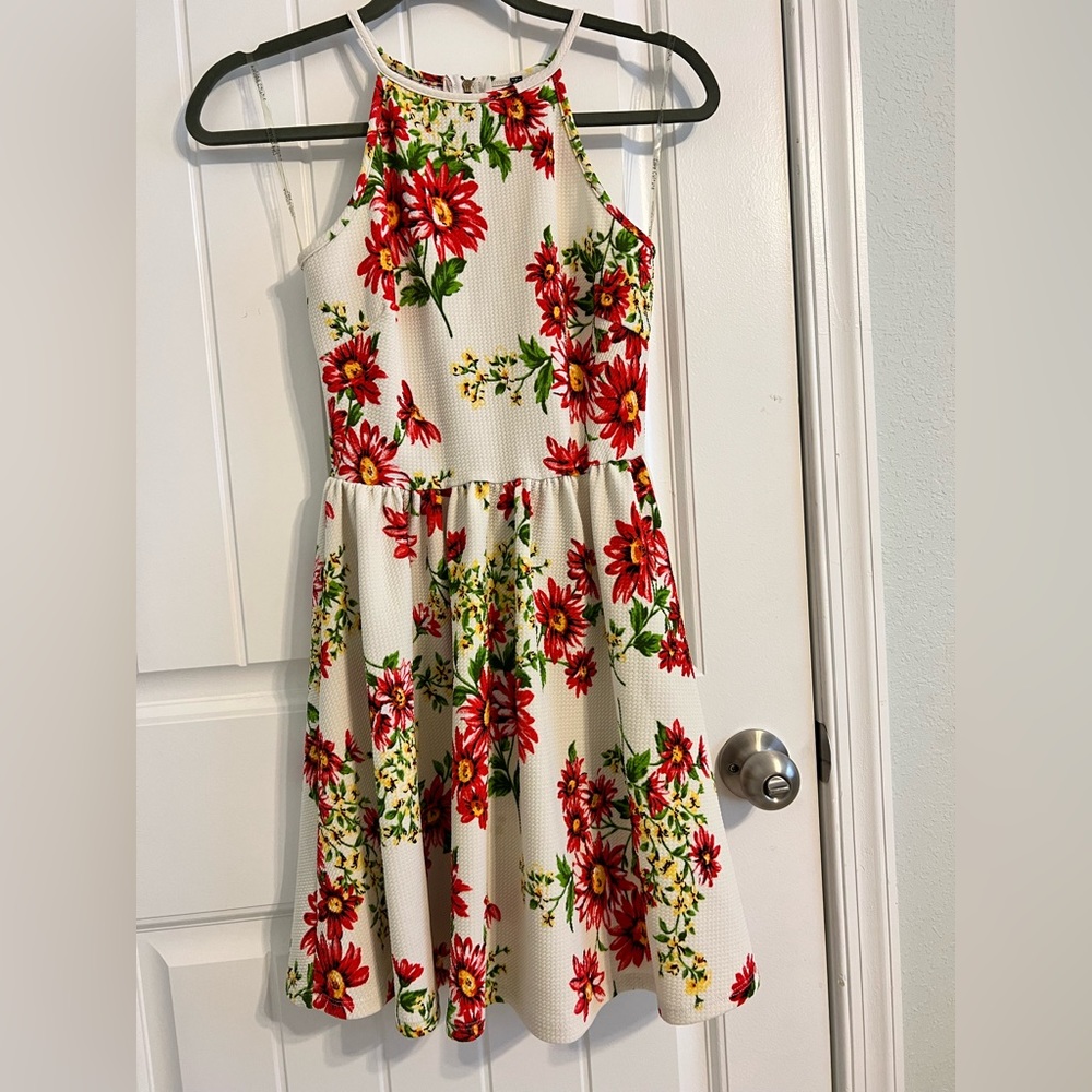 White dress with red floral pattern